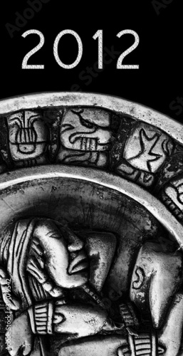 Photo: carved glyphs on a stone Mayan calendar with 2012 text carved glyphs on a stone Mayan calendar with 2012 text