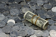 Roll of One Dollar Bills on coins background