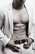 Muscular man with sexy abs and suit