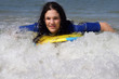 teen girl body-boarding