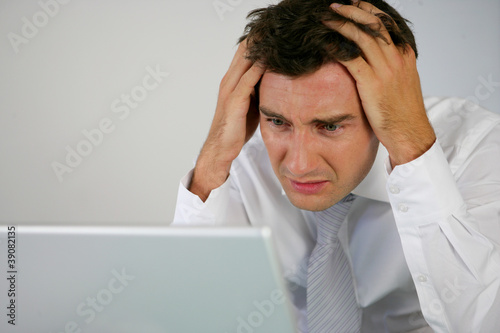Photo: A desperate businessman A desperate businessman