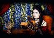 Photo: A portrait of the girl in Gothic style with the book in hands A portrait of the girl in Gothic style with the book in hands