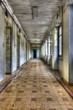 Long empty corridor and doors in abandoned building