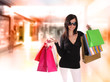 Shopping young woman in the shopping mall.
