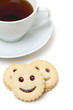 Photo: cup of tea and smiling cookies cup of tea and smiling cookies