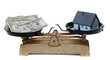 house and dollar notes on scale