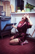 Shocked housewife in the kitchen baking something Shocked housewife in the kitchen baking something