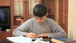 Teen prepares homework