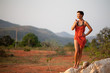 Beautiful  woman standing on a rock
