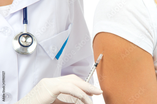 Photo: Doctor making insulin or flu vaccination Doctor making insulin or flu vaccination