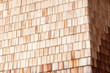 Sunny alpine wooden clapboard wall