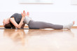 Woman doing stretching yoga exercise at sport gym Woman doing stretching yoga exercise at sport gym