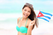 Cuba beach woman holding cuban flag