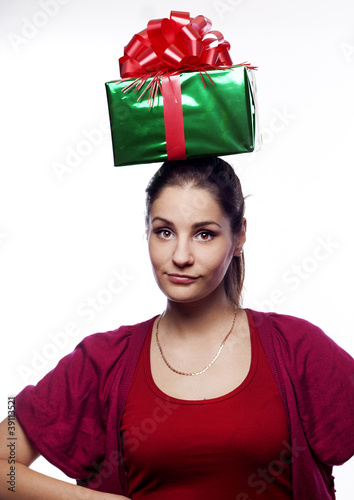Photo: Pretty young woman with present on her head Pretty young woman with present on her head