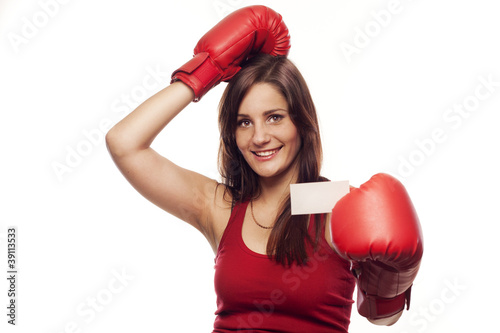 Photo: Young man with boxing gloves showing business card Young man with boxing gloves showing business card