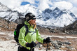 Woman trekking in Himalaya Mountains, sport and fitness outdoors Woman trekking in Himalaya Mountains, sport and fitness outdoors