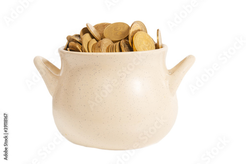 Photo: Ceramic pot with shiny coins isolated on white Ceramic pot with shiny coins isolated on white