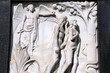 Adam and Eve - bas relief sculpture on a grave Adam and Eve - bas relief sculpture on a grave