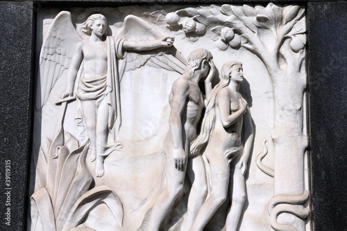 Photo: Adam and Eve - bas relief sculpture on a grave Adam and Eve - bas relief sculpture on a grave