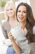 Happy Women Friends Drinking Tea or Coffee