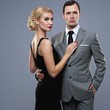 Retro couple on grey background.