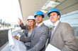 Construction engineers checking building site