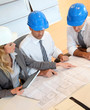 Architects and businesswomen working on construction project