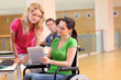 Handicapped person at work with electronic tablet