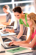 Colleagues in office working with tablet