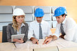 Architects and businesswomen working on construction project