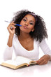 Photo: a beautiful dark-skinned woman with a note-book in a white dress a beautiful dark-skinned woman with a note-book in a white dress