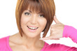 woman making a call me gesture