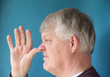 Foto: older man thumbs his nose older man thumbs his nose