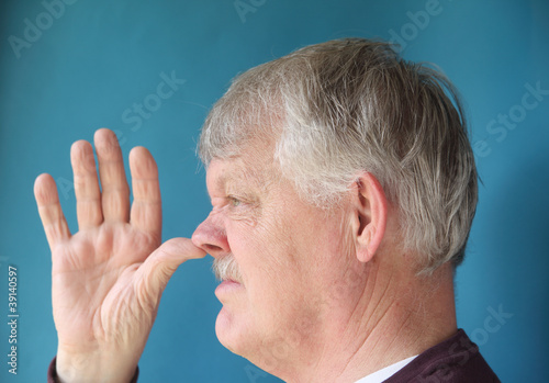 Photo: older man thumbs his nose older man thumbs his nose