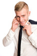 Young businessman with mischievious smile.