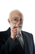 Photo: an old man sees through in magnifying lens an old man sees through in magnifying lens