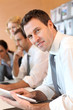 Portrait of business manager using electronic tablet
