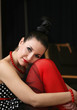 Beautiful young woman in red tights