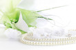 Photo: Wedding still life with necklace and bouquet Wedding still life with necklace and bouquet