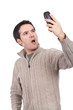 woman holding a cellphone and looking surprised woman holding a cellphone and looking surprised