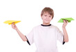 Photo: Little beautiful boy with paper airplanes on white background Little beautiful boy with paper airplanes on white background