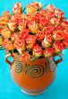 Beautiful roses in a old ceramic vase.