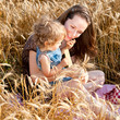 Woman and child in wheat field Woman and child in wheat field