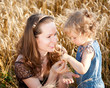 Woman and child in wheat field Woman and child in wheat field
