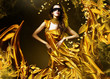 sensual adult woman in golden fabric and mask with leaves