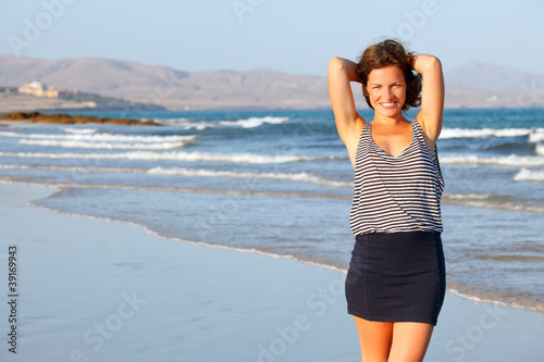 Photo: Young woman on a beach Young woman on a beach