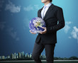 Photo: holding a glowing earth globe in his hand holding a glowing earth globe in his hand