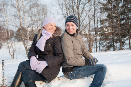 Photo: Man and woman sits on the wood Man and woman sits on the wood