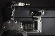 Photo: Pair of Handcuffs on Briefcase with 911 on Lock Pair of Handcuffs on Briefcase with 911 on Lock