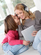 Mother and daughter listening to music